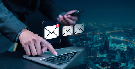 New email notification concept for business email communication. Businessman touching email on virtual screen. Internet technology. Mailbox receives electronic message notification.
