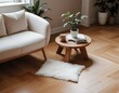 © Stock - A minimalist living room with a white armchair, a small wooden coffee table, and some plants and decorations on the floor.