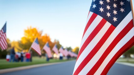 American flags lining a street as families gather to celebrate Veterans Day, showing appreciation for heroes