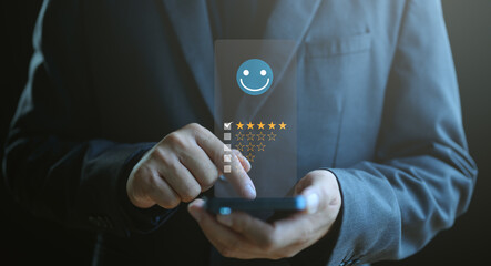 Online customer satisfaction survey concept, consumers or customer give five-star ratings and reviews on product quality and service, increasing business credibility and reputation ranking.