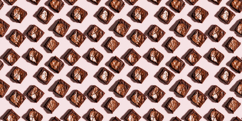 Wall Mural - A seamless pattern of brownies, each with its shadow, scattered across the canvas in an elegant display, with soft shadows on a soft pale pink color background