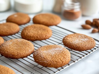 Freshly baked ginger cookies cooling on wire rack in bright kitchen setting