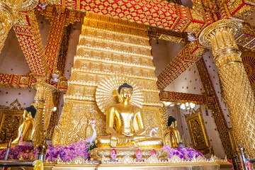 Wat Phra That Nong Bua, Ubon Ratchathani, inside there is the Phra That Sri Maha Bodhi Chedi, a replica of the Chedi in Bodh Gaya, India, stucco sculptures, candles, and two large Naga statues.