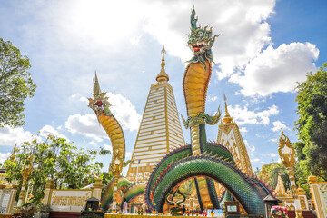 Wat Phra That Nong Bua, Ubon Ratchathani, inside there is the Phra That Sri Maha Bodhi Chedi, a replica of the Chedi in Bodh Gaya, India, stucco sculptures, candles, and two large Naga statues.