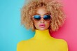 © Trushchenko_O - Woman with curly hair and pink lipstick is wearing a yellow shirt and sunglasses. Concept of confidence and style, as the woman is posing for the camera with a fashionable outfit and accessories