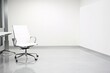 © thoriq - Modern Office Interior with White Walls and a Chrome Chair