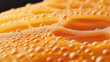 © altitudevisual - Close-up view of orange liquid with bubbles, showing surface texture and reflections in a macro perspective.