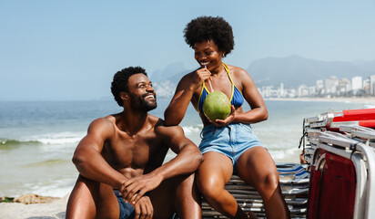 Happy couple enjoying a sunny day on Rio de Janeiro beach