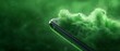 © Janis - A tight shot of a cell phone suspended in mid-air against a backdrop of green A cloud of fine particles swirls around, suggesting recent disturbance