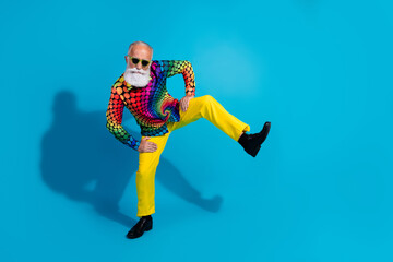 Full length photo of eccentric funky aged man dance step empty space isolated on blue color background