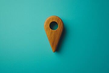 Minimalist wooden location marker with a turquoise background. Perfect for travel, navigation, or location-based themes.