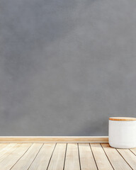 Minimalistic interior with gray wall and wooden floor featuring a simple plant pot