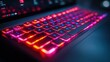 © arsyi_06 - Close-up of a backlit laptop keyboard with red and blue lighting.