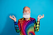 © deagreez - Photo of eccentric funky aged man meditate wear shirt isolated on blue color background