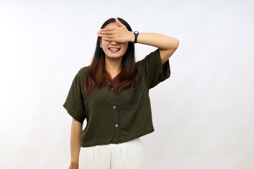 Young woman wearing casual shirt smiling and laughing with hand on face covering eyes for surprise. blind concept.