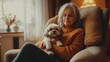 © Lion - Elderly woman with silver hair holding a small Shih Tzu dog, sitting in a cozy armchair in a warmly lit living room