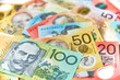 © Austockphoto - Collection of Australian banknotes scattered on a flat surface.