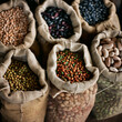 © Purple_Lamp - Various Raw Beans and Legumes in Burlap Bags on Display at Market