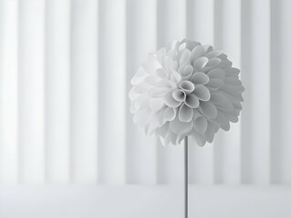 A minimalist white flower sculpture on a slender stem against a soft, textured background.