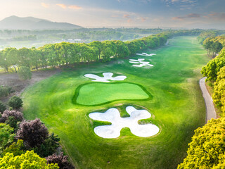 Wall Mural - Aerial shot of golf course and mountain scenery