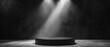 © CYBERPINK - A black podium with a spotlight shining on it