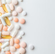 © PixelCharm - Colorful assortment of pills and vitamins on a light background