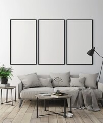 Modern living room interior with grey sofa, two coffee tables, and three empty frames on the white wall