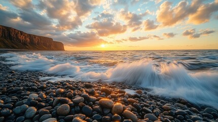 Wall Mural - A stunning sunset over a rocky beach with crashing waves.