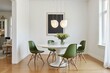 © velikiyzayats - Modern dining room features white marble table, olive green chairs, and elegant pendant lights creating serene and stylish atmosphere