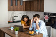 © Sanja_85 - Stressed Couple Discussing Finances in Modern Kitchen