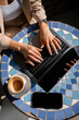 © DZ FILM/Stocksy - Women's hands typing on a laptop