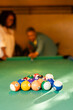 © Camelia Elisabeta Utalea/Stocksy - A couple plays pool in a snack bar