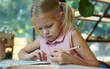 © romaset - A young mother and her daughter enjoy a creative art session at home