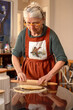 © tessy morelli/Stocksy - candid home hobby moment making dough