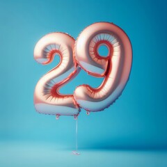 balloon in a shape of number 29 on blue background for birthday celebration