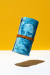 © Tarık Kızılkaya/Stocksy - Brazilian real money roll hovering on and brown white background