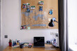 © Oleksii Syrotkin/Stocksy - Blackboard over table with open laptop with graph at home workplace