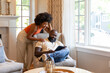 © Raymond Forbes LLC/Stocksy - African American home family Lifestyle  video call