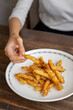 © Watcharawit Phudork/Stocksy - French fries with seasoning