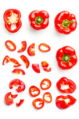 Wall Mural - Vertical Set of fresh whole and sliced red sweet pepper isolated on white background. Top view.