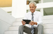 © peopleimages.com - Tablet, reading and mature of business man in office for planning, private equity associate and research. Portfolio management, risk analysis and capital investment with person in finance firm