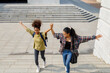 © Jovo Jovanovic/Stocksy - Carefree high school girls climbing stairs