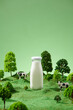 © Marc Tran/Stocksy - Bottle of milk and cows on green field.