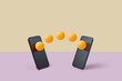 © Yaroslav Danylchenko/Stocksy - Two smartphones with orange balls bouncing between their screens