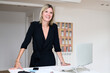 © Guille Faingold/Stocksy - Smiling businesswoman portrait