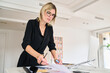 © Guille Faingold/Stocksy - Focused individual working at a modern office desk