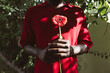 © Tanya Yatsenko/Stocksy - A man with a red flower