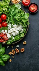 Canvas Print - Fresh colorful salad with french cheese and greens on dark background