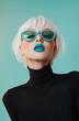 © sunaiart - A high-fashion portrait of an attractive woman with white hair, wearing teal sunglasses and bright blue lipstick against a pastel background.
