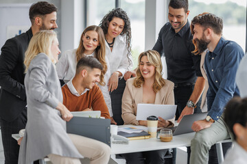 Wall Mural - Diverse Team Collaborating in a Modern Office Environment